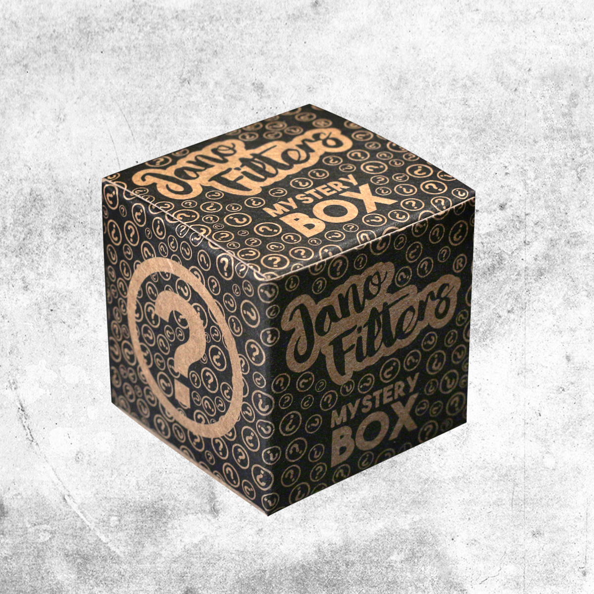 Mystery Box Jano Filters negra y dorada con motivos de interrogación