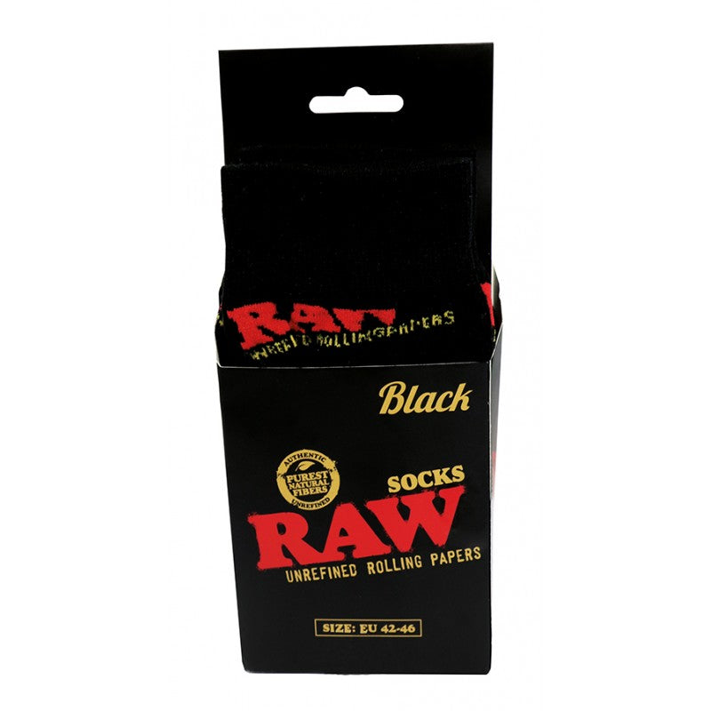 RAW Calcetines Black caja abierta mostrando los calcetines negros con diseño RAW